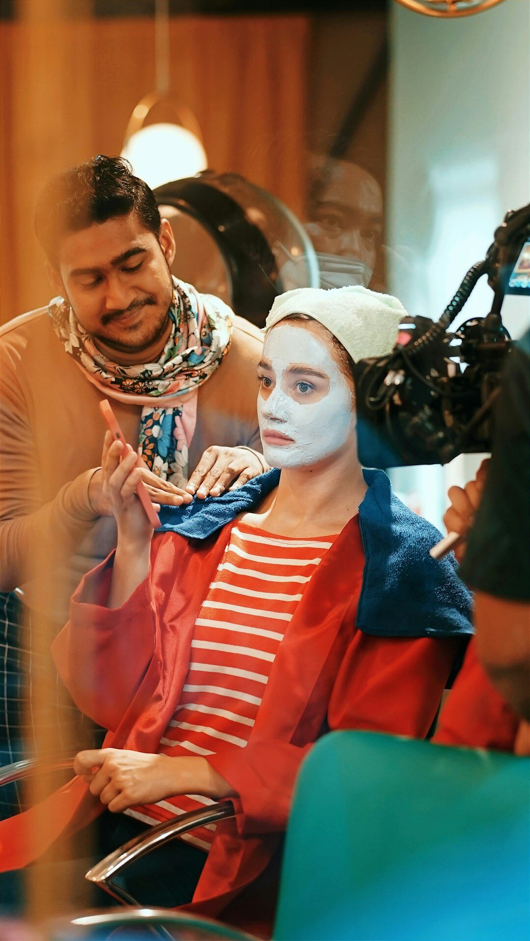 Makeup artist preparing a guest before a show