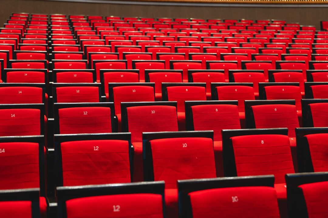 Empty cinema theater with red seats