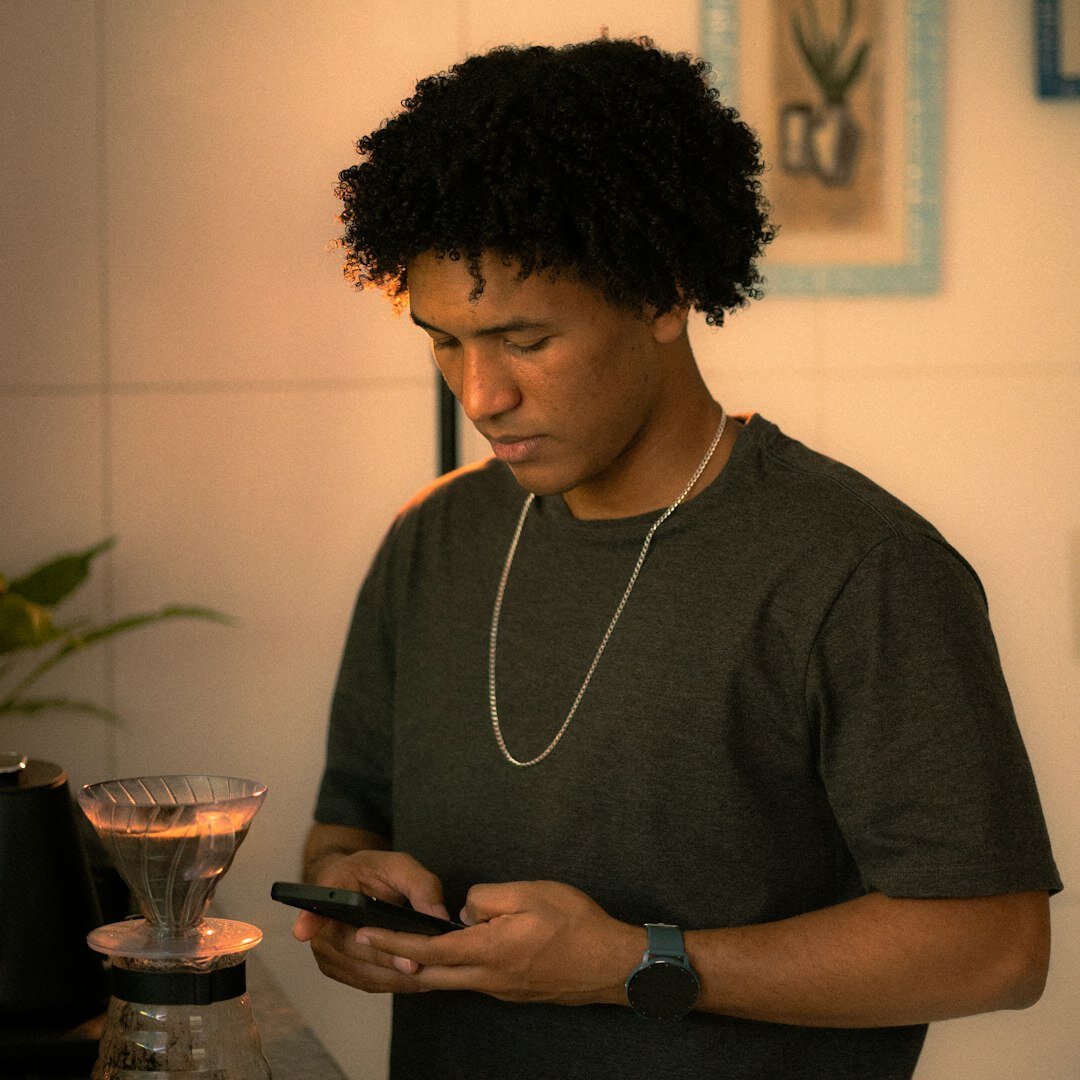 Young influencer filming content with a phone