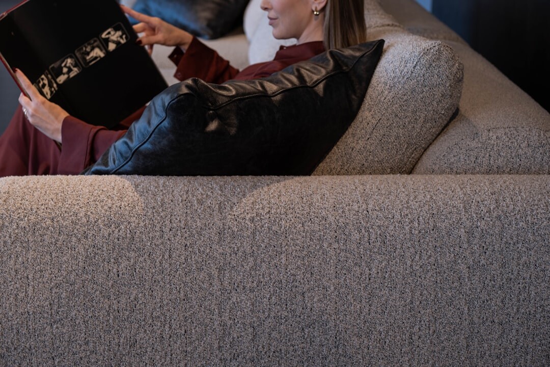 woman reading book at home