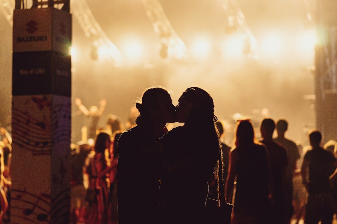 Silhouettes of a couple at an evening event