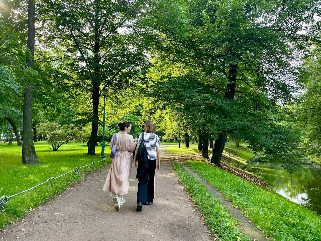 happy couple walking in park