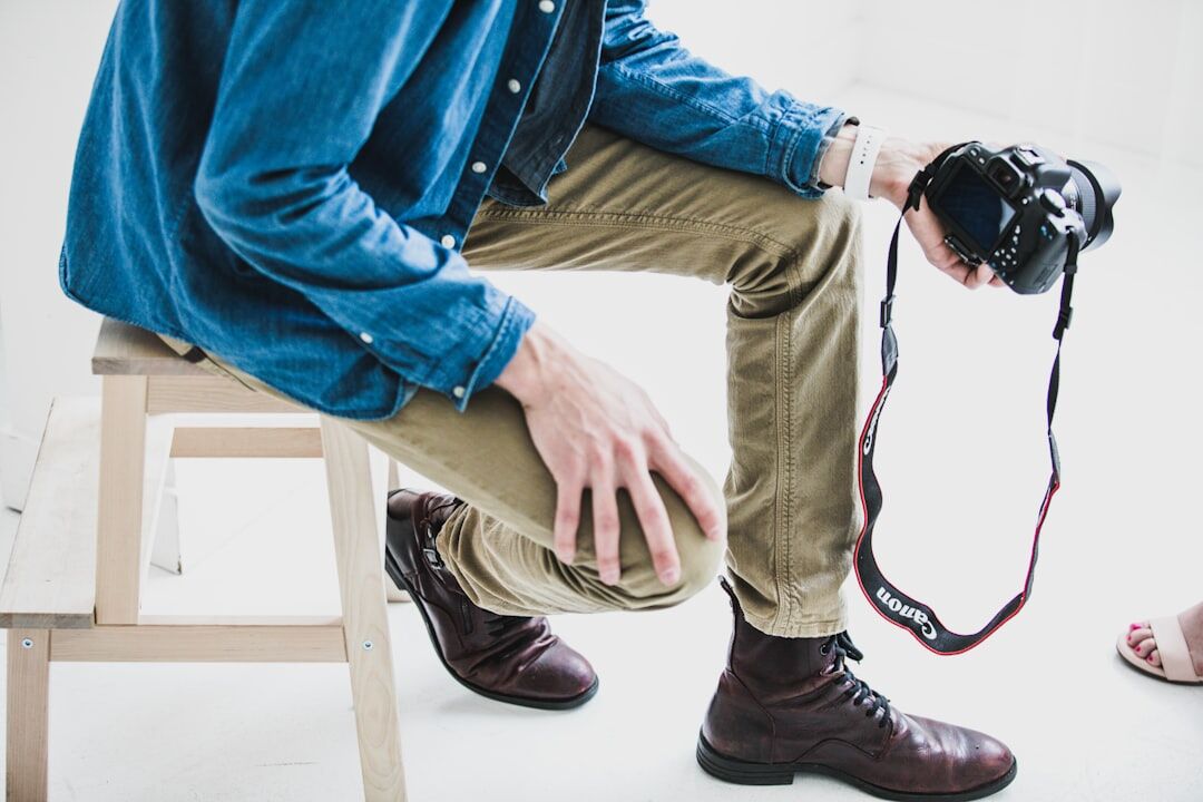 Photographer crouching to take a photo at an event