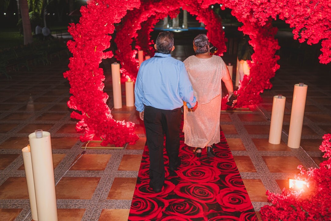 Celebrity walking on a red carpet at an evening event